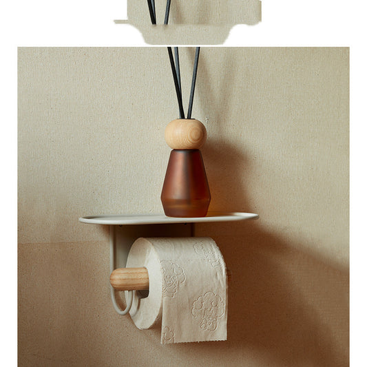 Perforation-free toilet paper rack mounted on a clean white bathroom wall