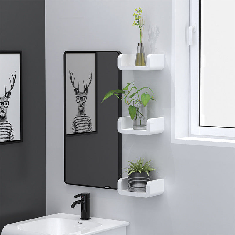 Waterproof wall mounted bathroom shelf holding toiletries near a shower